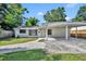 Charming single-story home with a carport, walkway, and lush lawn at 1308 Oregon St, Orlando, FL 32803