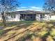 A spacious backyard with a screened in lanai, providing a perfect space for outdoor relaxation and entertaining at 133 Hickory Course Circle, Ocala, FL 34472