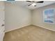 A cozy bedroom with carpeted floor and a ceiling fan for added comfort at 133 Hickory Course Circle, Ocala, FL 34472