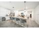 Bright kitchen featuring a large island, modern appliances, and stylish pendant lighting at 133 Hickory Course Circle, Ocala, FL 34472