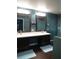 Bathroom features dual sinks, wide mirrors, and good lighting with private toilet and shower stall at 1420 Center St, Ocoee, FL 34761