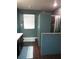 Bathroom features a walk in tiled shower, modern floors, and a dedicated toilet room at 1420 Center St, Ocoee, FL 34761
