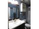 Charming bathroom featuring a framed mirror, vanity, and a shower at 1420 Center St, Ocoee, FL 34761