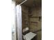 Accessible bathroom shower with tile walls, a shower seat, a grab bar, and a shower curtain at 1420 Center St, Ocoee, FL 34761