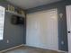 Bedroom featuring a closet and mounted television on a shelf at 1420 Center St, Ocoee, FL 34761