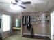 Bedroom with built-in shelving, a work desk, and a mini fridge at 1420 Center St, Ocoee, FL 34761