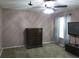 Bedroom showcasing neutral carpet, natural light, and a solid wood dresser at 1420 Center St, Ocoee, FL 34761