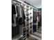Spacious walk-in closet featuring built-in shelving and hanging racks for efficient storage solutions at 1420 Center St, Ocoee, FL 34761