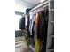 Organized closet featuring tiered shelving, hanging rods, and visible window for natural light at 1420 Center St, Ocoee, FL 34761