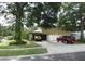 Spacious driveway leads to an attached garage, offering ample parking and convenience at 1420 Center St, Ocoee, FL 34761