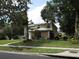Charming two-story home features manicured lawn, mature trees, and a welcoming front entrance at 1420 Center St, Ocoee, FL 34761