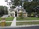 Charming two-story home features manicured lawn, mature trees, and a welcoming front entrance at 1420 Center St, Ocoee, FL 34761