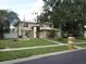 Charming two-story home features manicured lawn, mature trees, and a welcoming front entrance at 1420 Center St, Ocoee, FL 34761