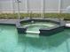 The pool features a built-in hot tub with a waterfall feature and a safety railing at 1420 Center St, Ocoee, FL 34761