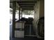 Outdoor kitchen features a grill, sink, bar, and a safety gate at 1420 Center St, Ocoee, FL 34761