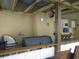 Spacious outdoor kitchen features a full grill, sink, bar, tv, and seating at 1420 Center St, Ocoee, FL 34761