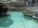 A clear pool with a built-in hot tub is screened-in for ultimate relaxation at 1420 Center St, Ocoee, FL 34761