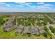 Aerial view of a home in a Primary-planned community, featuring lush landscaping and a fenced-in backyard at 15424 Sweet Orange Ave, Winter Garden, FL 34787
