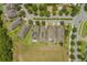 Aerial view of homes showing well-maintained roofs, solar panels, screened patios, and landscaping at 15424 Sweet Orange Ave, Winter Garden, FL 34787