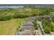 Scenic aerial view of homes with lush landscaping near a body of water at 15424 Sweet Orange Ave, Winter Garden, FL 34787