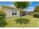 Well-maintained backyard showing the home's exterior and the screened lanai at 15424 Sweet Orange Ave, Winter Garden, FL 34787