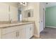 Bathroom with granite countertops, double sinks, and white cabinetry providing great storage at 15424 Sweet Orange Ave, Winter Garden, FL 34787