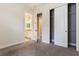 Bedroom with carpet flooring, closet and ensuite bathroom for convenience and privacy at 15424 Sweet Orange Ave, Winter Garden, FL 34787