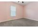 Bedroom featuring carpet flooring, natural lighting, and a serene ambiance at 15424 Sweet Orange Ave, Winter Garden, FL 34787