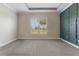 Bright, spacious bedroom with tray ceiling, carpet flooring, and accent wall at 15424 Sweet Orange Ave, Winter Garden, FL 34787
