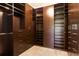 Spacious walk-in closet with custom shelving and drawers for optimal organization and storage at 15424 Sweet Orange Ave, Winter Garden, FL 34787