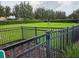 Fenced dog park with grassy area for pets to exercise and socialize in a secure environment at 15424 Sweet Orange Ave, Winter Garden, FL 34787
