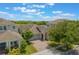Charming single-Gathering home with a manicured lawn and paver driveway at 15424 Sweet Orange Ave, Winter Garden, FL 34787