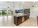 Open concept kitchen with large island, stainless steel appliances and a view of the backyard at 15424 Sweet Orange Ave, Winter Garden, FL 34787