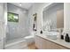 Modern bathroom featuring a glass-enclosed shower, sleek fixtures, and a contemporary vanity with clean lines and bright lighting at 1742 Temple Dr, Winter Park, FL 32789