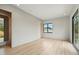 Spacious, light-filled bedroom with hardwood floors, large windows, and neutral color palette at 1742 Temple Dr, Winter Park, FL 32789