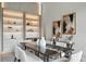Elegant dining space with a modern table, plush seating, and artistic decor for sophisticated meals at 1742 Temple Dr, Winter Park, FL 32789
