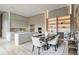 Contemporary dining area featuring a sleek dining table, six chairs, and illuminated display shelving at 1742 Temple Dr, Winter Park, FL 32789