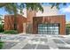 Contemporary home featuring distinctive wood siding and artistic driveway, enhanced by lush greenery at 1742 Temple Dr, Winter Park, FL 32789
