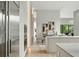 Open-concept view from kitchen to living room with sleek stainless appliances and modern dining space at 1742 Temple Dr, Winter Park, FL 32789