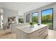 Stunning kitchen with a large island, modern appliances, and views of lush greenery outside at 1742 Temple Dr, Winter Park, FL 32789