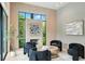 Bright living room with modern fireplace, neutral walls, hardwood floors, and large view window at 1742 Temple Dr, Winter Park, FL 32789