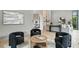 Open-concept living room with modern decor, neutral walls, hardwood floors, and view to the kitchen at 1742 Temple Dr, Winter Park, FL 32789