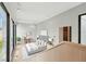 Bright main bedroom features large windows, closet, and light wood floors at 1742 Temple Dr, Winter Park, FL 32789