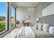 Bright main bedroom features large windows with natural light, light wood floors, and modern aesthetic at 1742 Temple Dr, Winter Park, FL 32789