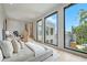 Modern main bedroom features large windows with natural light, light wood floors, and modern aesthetic at 1742 Temple Dr, Winter Park, FL 32789
