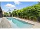 Modern pool with wooden deck, bamboo surround, and inviting water at 1742 Temple Dr, Winter Park, FL 32789
