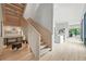 Elegant staircase with open design, wood treads, and built-in desk, blending architectural detail with functional workspace at 1742 Temple Dr, Winter Park, FL 32789