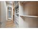 Organized walk-in closet featuring custom shelving, drawers, and hanging space, offering ample storage with a clean aesthetic at 1742 Temple Dr, Winter Park, FL 32789