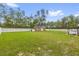 Expansive backyard with privacy fence and shed provides ample space for outdoor activities at 17485 Sw 36Th Ter, Ocala, FL 34473