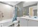 Charming bathroom features a shower-tub combo and single sink vanity with modern fixtures at 17485 Sw 36Th Ter, Ocala, FL 34473